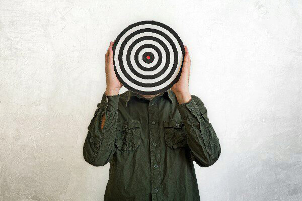 man holding a bullseye